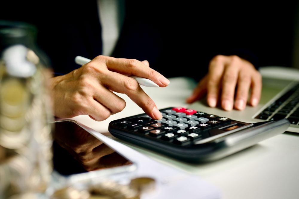 A person using a calculator.